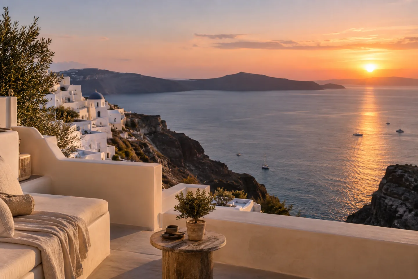 A private Santorini terrace overlooking the caldera at sunset.