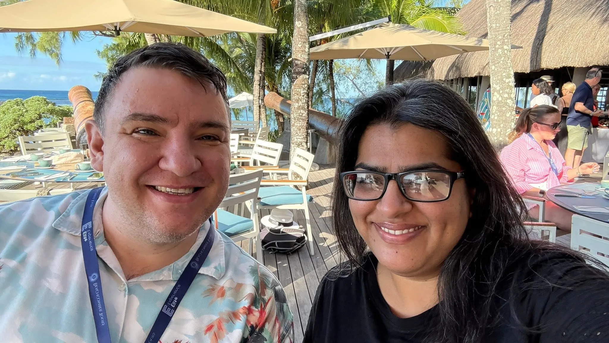 Sarita and Luke together under a parasol in Mauritius