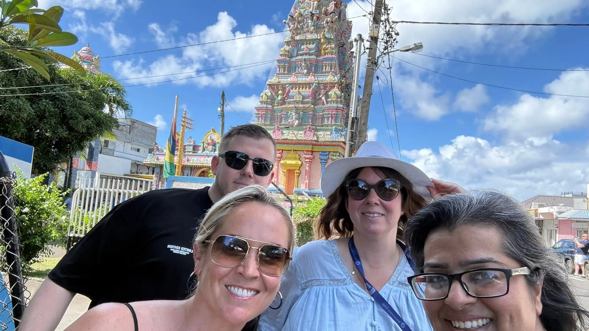 Sarita and friends in front of a colourful temple in mauritius