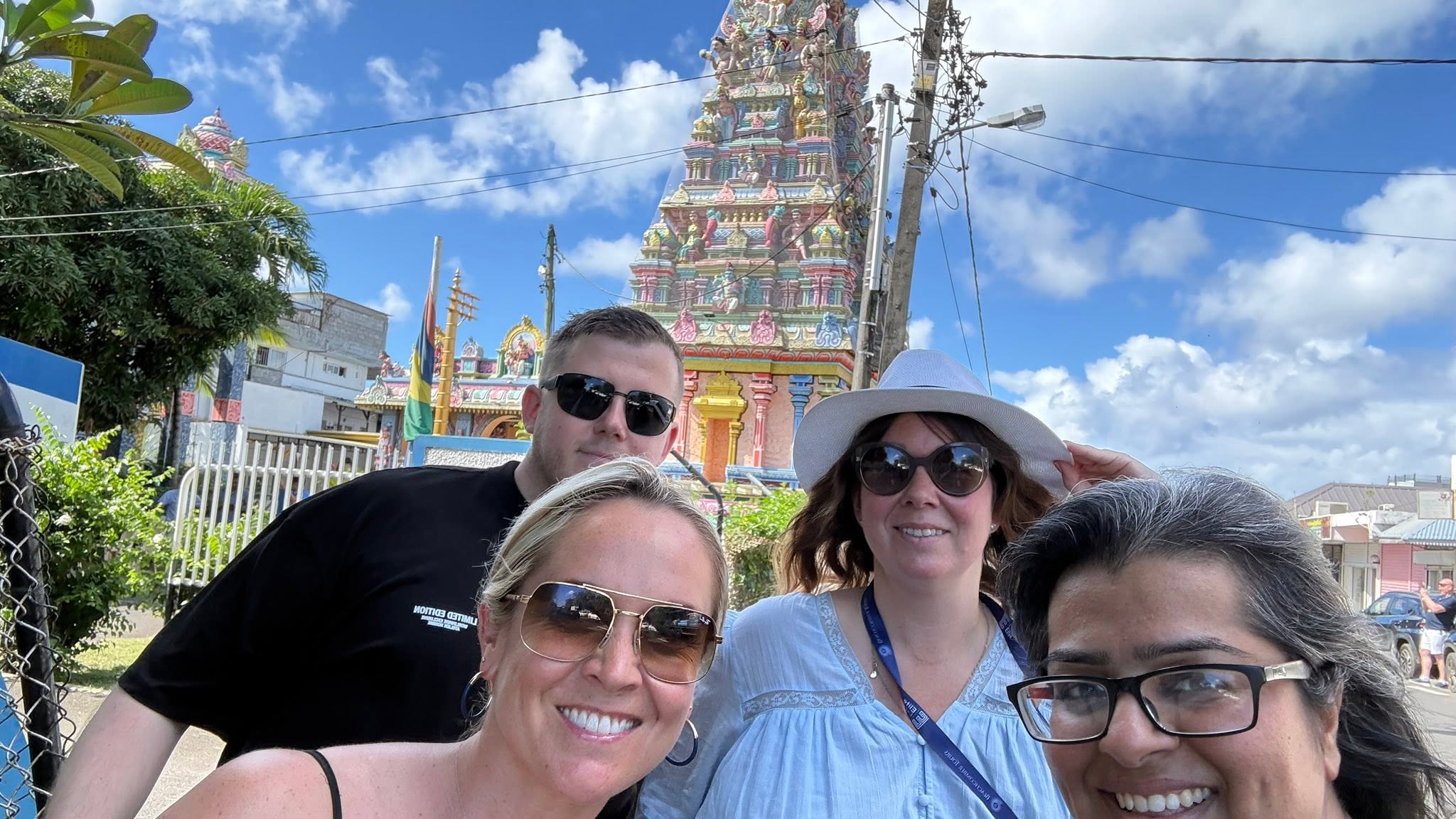 Sarita and friends in front of a colourful temple in mauritius